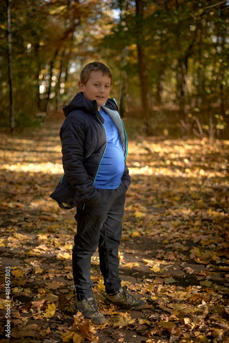 Boy and autumn in park
