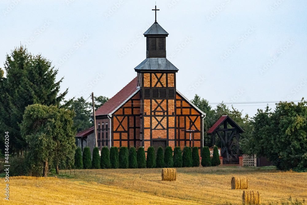 Old brick Catholic church in the Polish countryside Old brick Catholic church in the Polish countryside