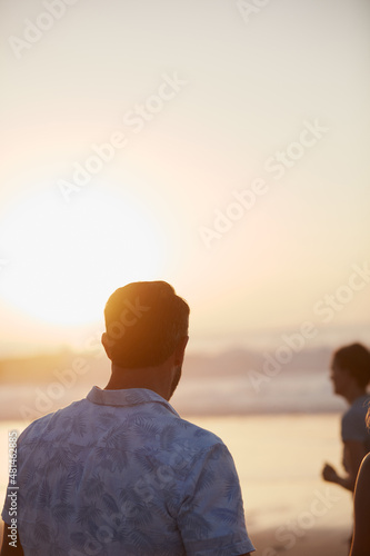 Seeing her happy completes me. Rearview shot of a mature couple spending quality time on the beach.