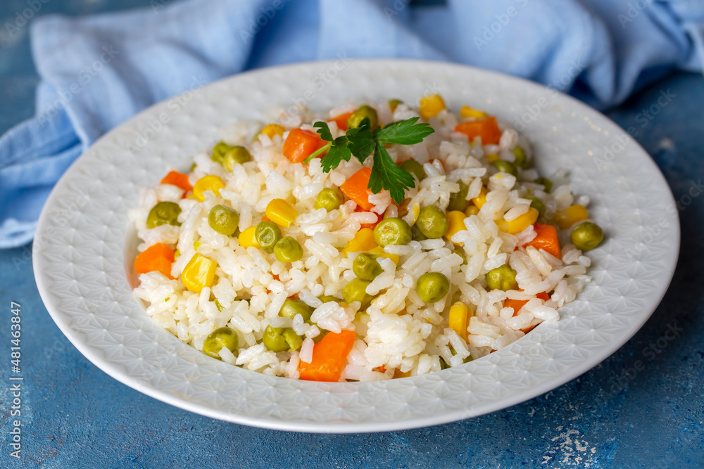 Delicious vegetable rice pilaf with green peas, carrots and sweet corn (Turkish name; sebzeli pilav) Delicious vegetable rice pilaf with green peas, carrots and sweet corn (Turkish name; sebzeli pilav)