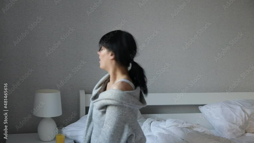 woman sitting on sofa. Love girl. Sensual. Bedroom. Smiling. Bed. woman sitting on sofa. Love girl. Sensual. Bedroom. Smiling. Bed.