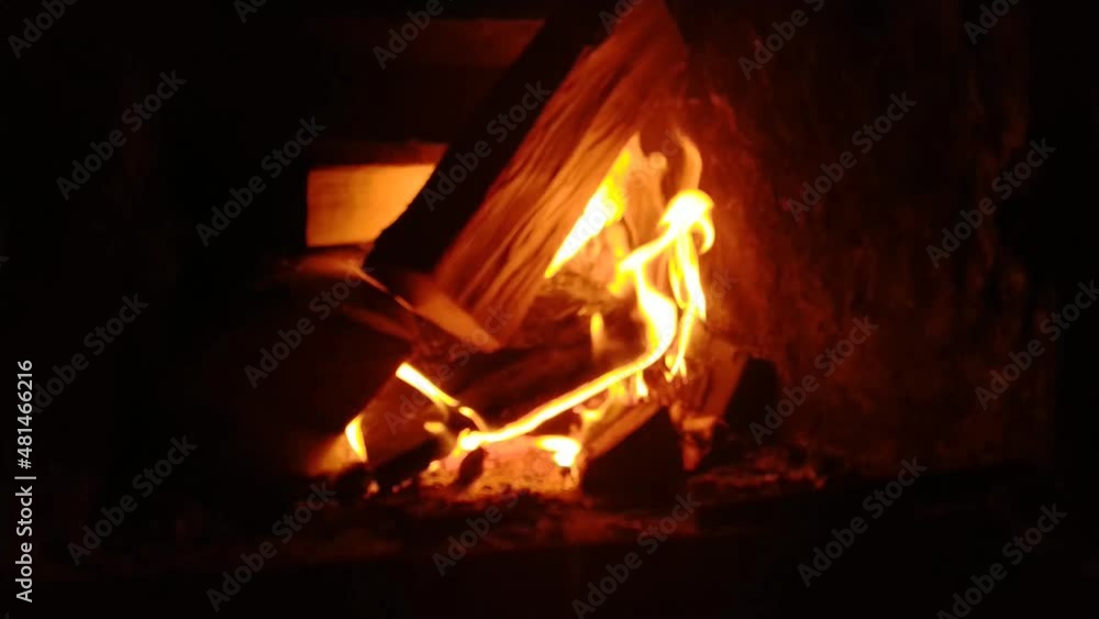 Blurred video of a fire in a fireplace shot from the left side Blurred video of a fire in a fireplace shot from the left side