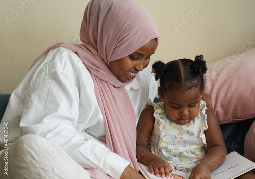 Valokuva Mother and daughter reading book