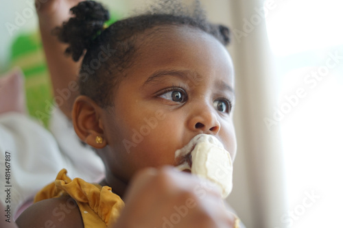 Girl eating ice-cream photo