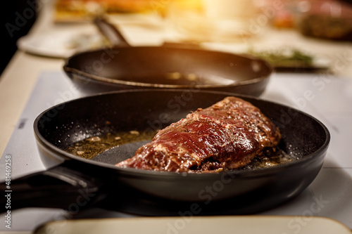 Beef tenderloin fried in a pan.