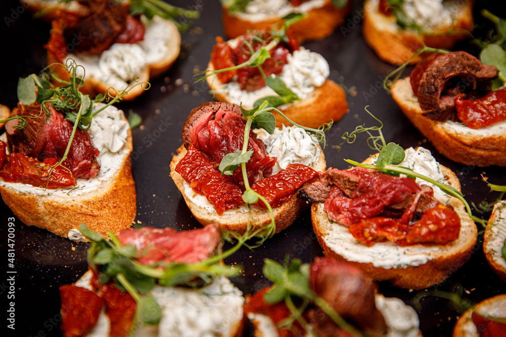 Top view of Bruschettas with beef Top view of Bruschettas with beef