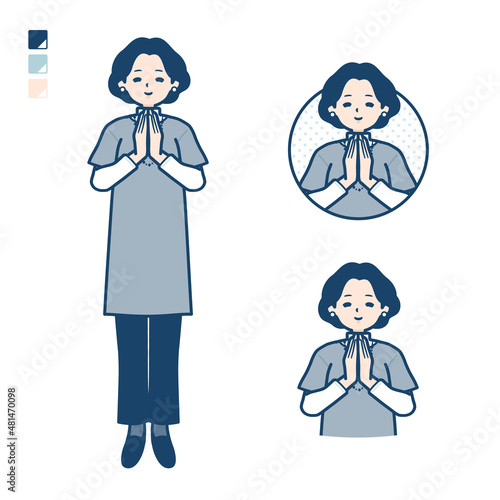 チュニック中年女性が合掌しているイラスト