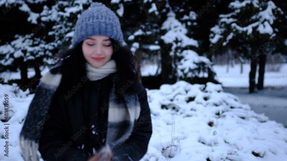 woman in snowy forest and throwing handful of snow. Cheerful girl enjoying beautiful winter day. Winter time 4K 300mb s woman in snowy forest and throwing handful of snow. Cheerful girl enjoying beautiful winter day. Winter time 4K 300mb s
