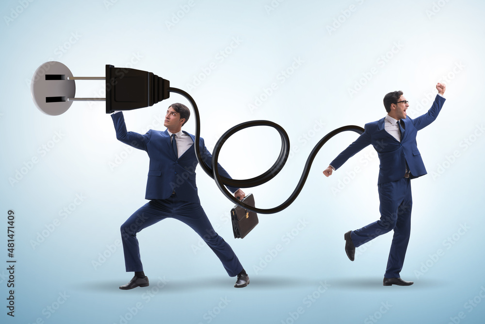 Fototapeta premium Businessman being powered by electric power