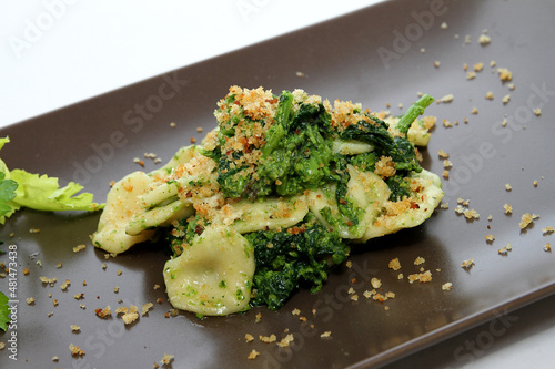 Italian cuisine - Orecchiette with turnip greens, traditional pasta from Puglia photo