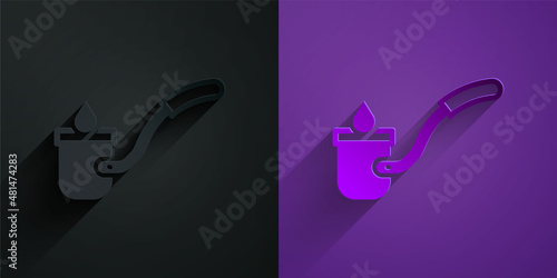 Paper cut Sauna ladle icon isolated on black on purple background. Paper art style. Vector