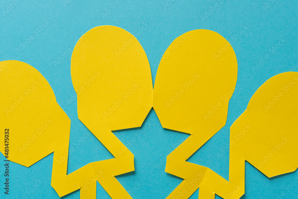roundish yellow paper shapes on a bright blue background roundish yellow paper shapes on a bright blue background
