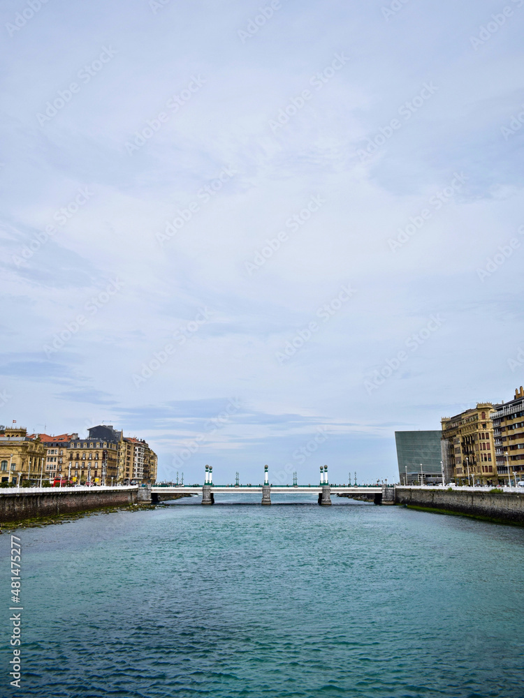 Zurriola Bridge. Image of the bridge in the morning hours with view to the sea. Vertical image.