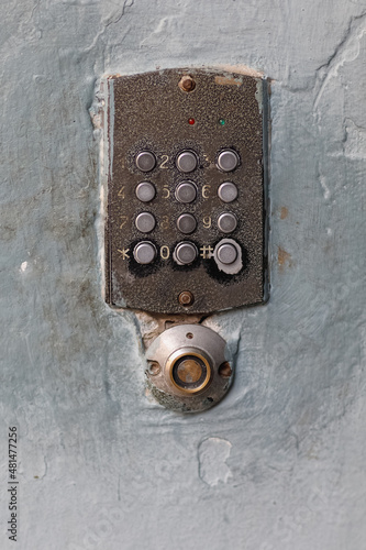 old doorbell button panel and intercom.