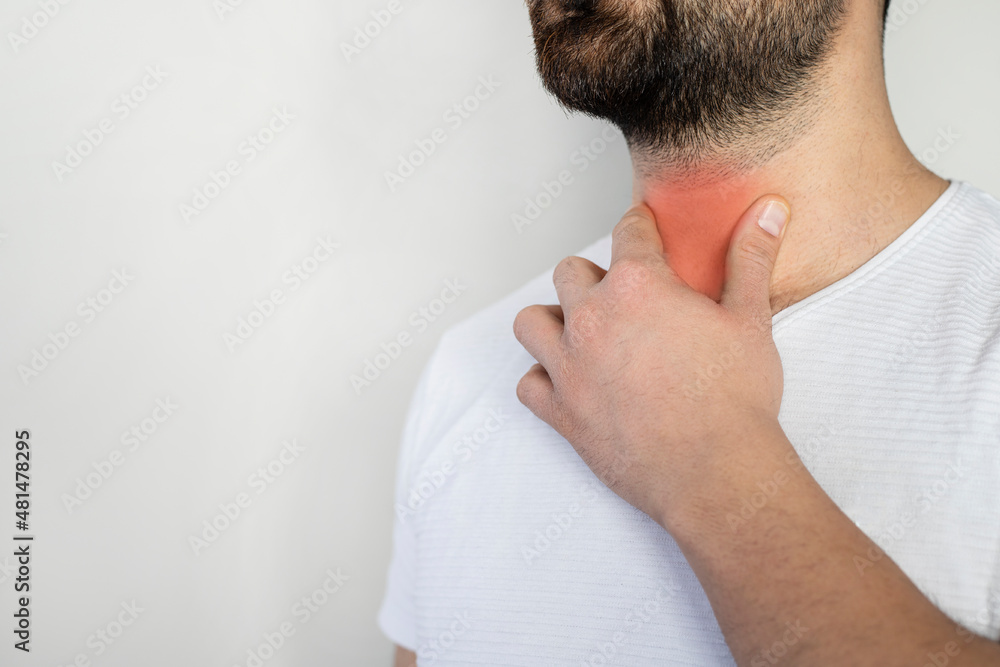 Obraz premium Sore throat. Men touching the neck