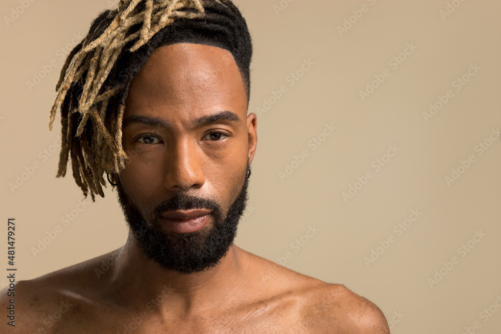 Studio portrait of young man with dreadlocks Studio portrait of young man with dreadlocks