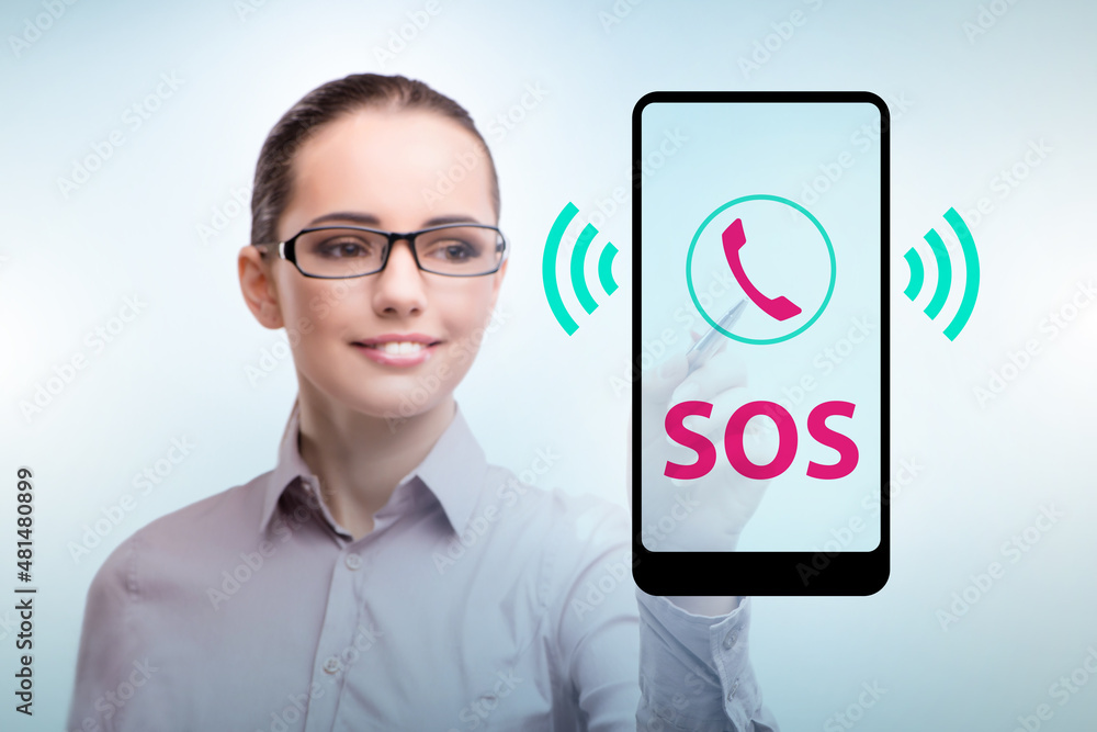 Businesswoman pressing SOS button in case of danger Businesswoman pressing SOS button in case of danger