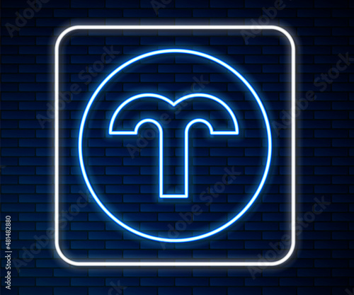Glowing neon line Aries zodiac sign icon isolated on brick wall background. Astrological horoscope collection. Vector