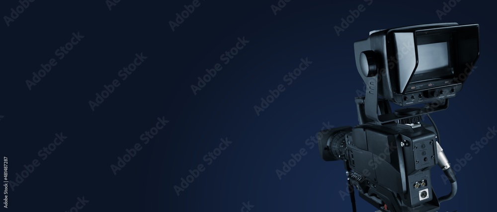 Digital film camera in the dark wall background. Video camera for film production, Digital film camera in the dark wall background. Video camera for film production,