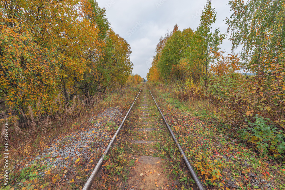 Old railway line at autumn day time.