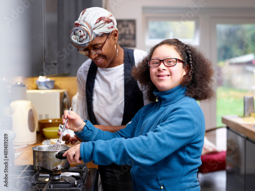 Photography Mother with daughter with Down Syndrome cooking together