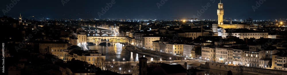 Florence, Ponte Vecchio, Arnolfo tower and river Arno. Cultural famous places in hi-res shot. Tuscany, Italy.