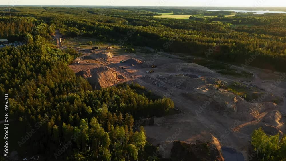 Aerial drone view overlooking a sunlit road construction site, during golden hour Aerial drone view overlooking a sunlit road construction site, during golden hour