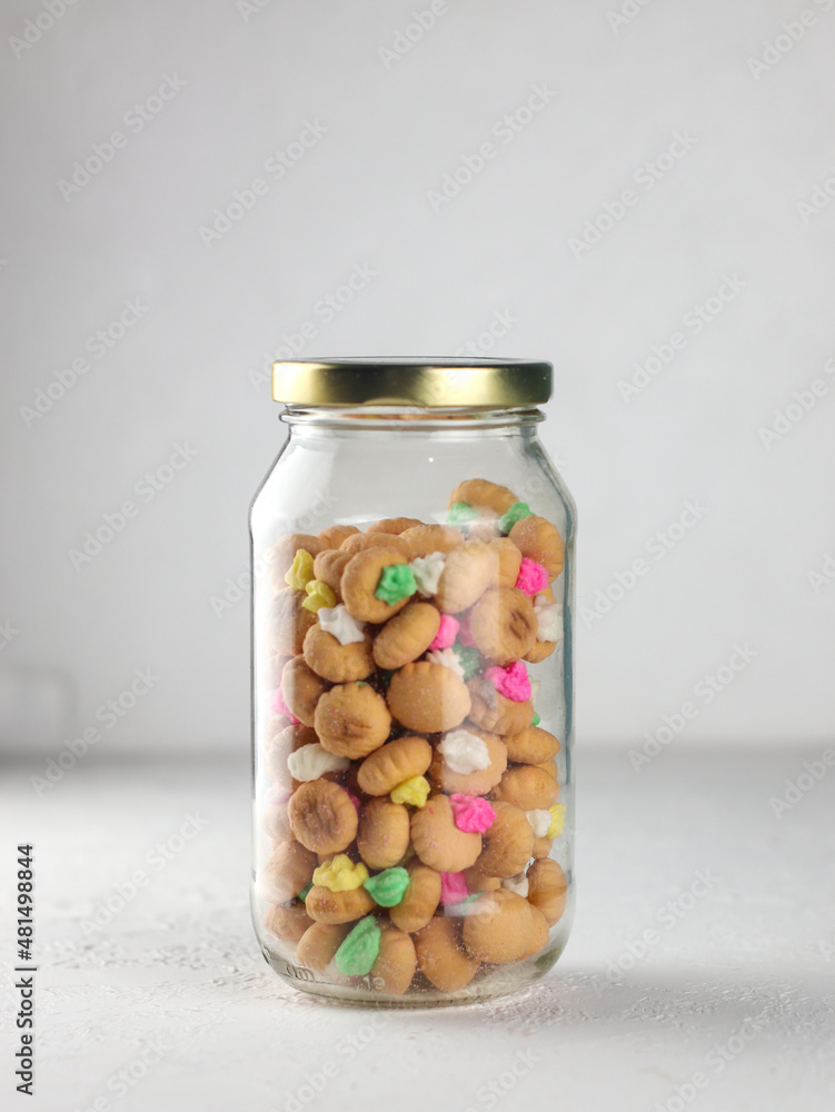 gemrose cake inside jar, a traditional snack from Indonesia, it tastes sweet topped with colorful sugar candy gemrose cake inside jar, a traditional snack from Indonesia, it tastes sweet topped with colorful sugar candy