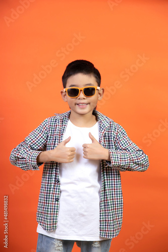 Happy boy showing like with his hands