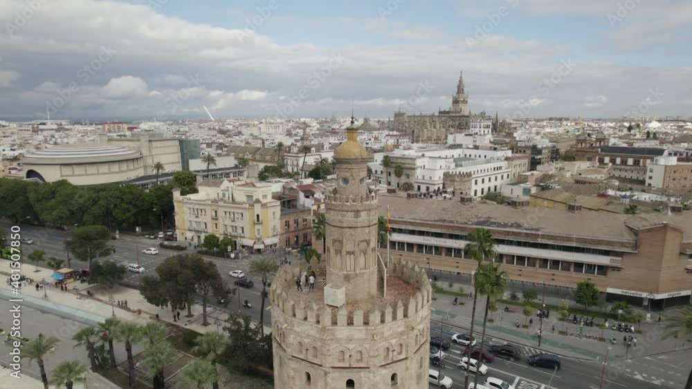 Orbiting view tourists on torre del oro, Guadalquivir riverside, Seville cityscape, Spain Orbiting view tourists on torre del oro, Guadalquivir riverside, Seville cityscape, Spain