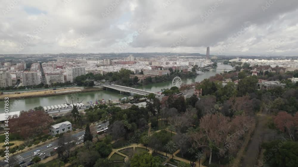 Flyover Maria luisa park towards Guadalquivir river on City center. Seville, Spain Flyover Maria luisa park towards Guadalquivir river on City center. Seville, Spain