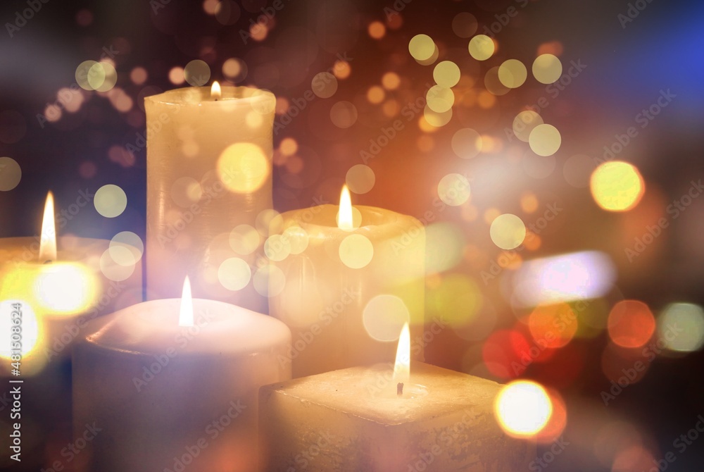 Abstract Advent, colored Candles With Soft Blurry Lights And Glittering On Flames Abstract Advent, colored Candles With Soft Blurry Lights And Glittering On Flames