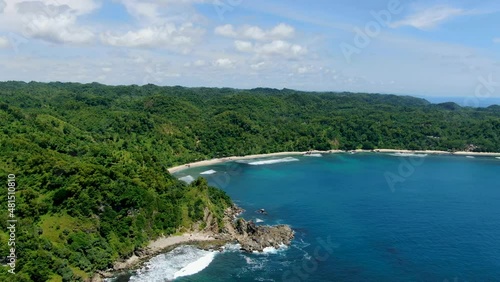 Pristine Wediombo beach, Indonesia surrounded by tropical rain forest, aerial   photo