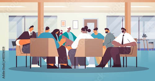 mix race people communicating while sitting in circle therapy group meeting addiction treatment concept