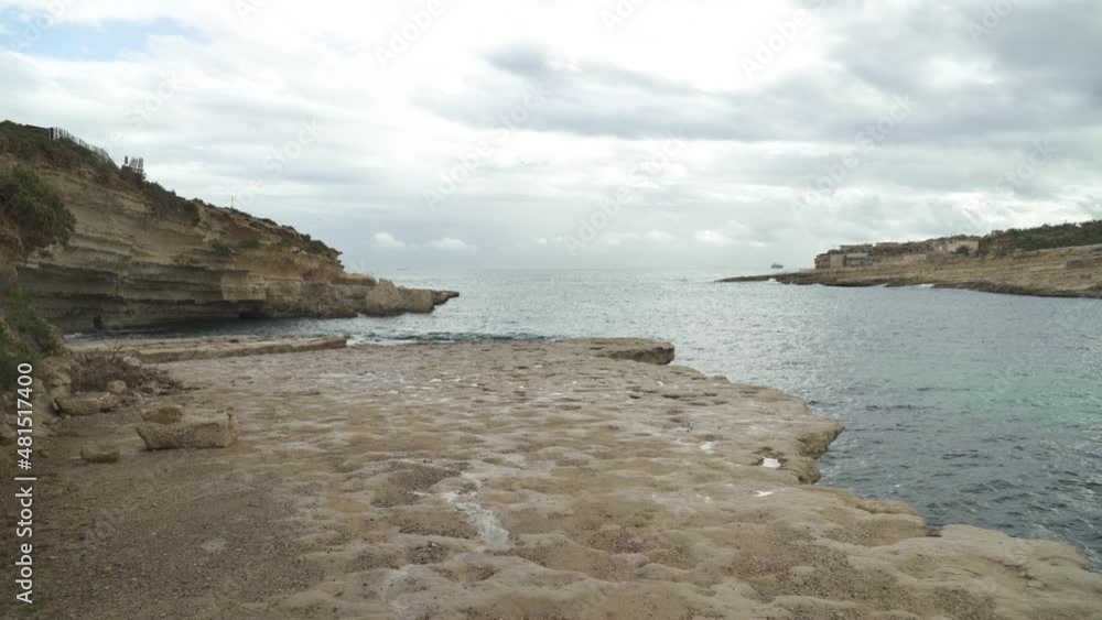 Plateau of Il-Kalanka Beach in Malta with Splashing Turquoise Colour Water in Bay Plateau of Il-Kalanka Beach in Malta with Splashing Turquoise Colour Water in Bay