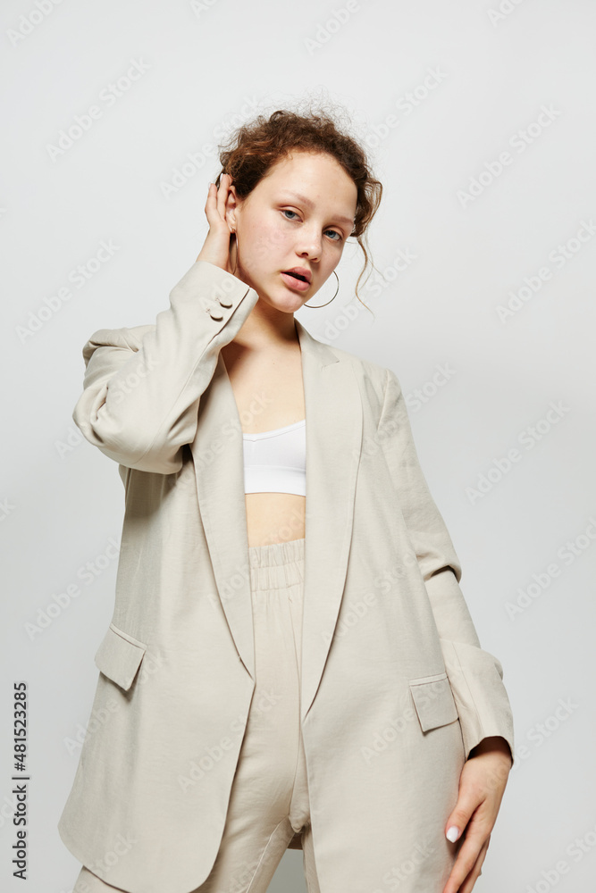 cheerful woman in a suit gestures with his hands Lifestyle unaltered cheerful woman in a suit gestures with his hands Lifestyle unaltered