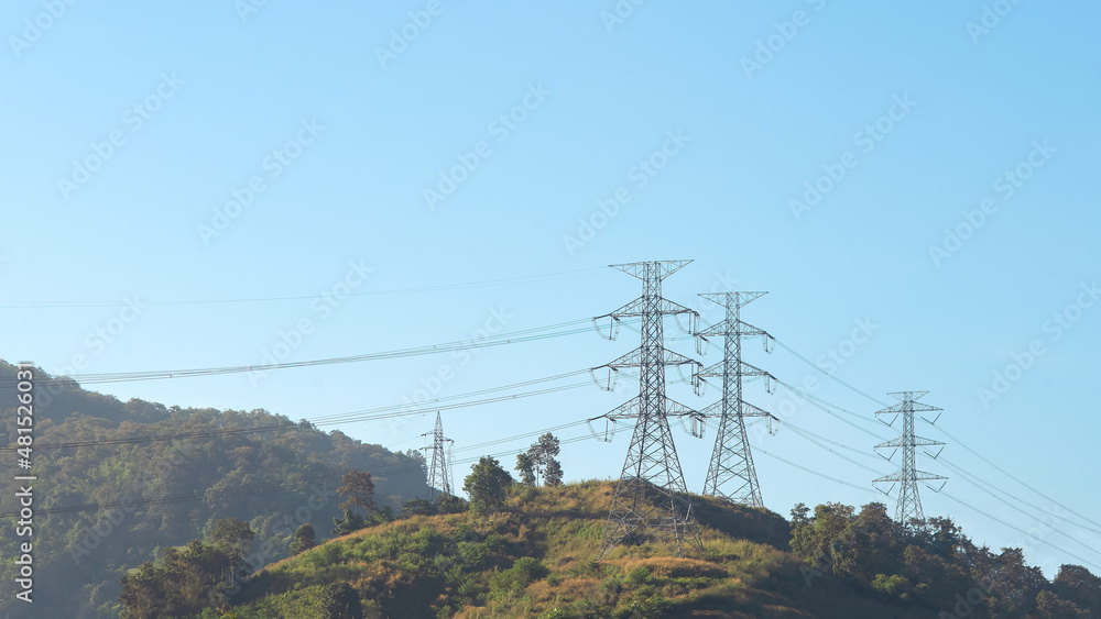 Mountain and electric.High voltage electric pole in the forest.