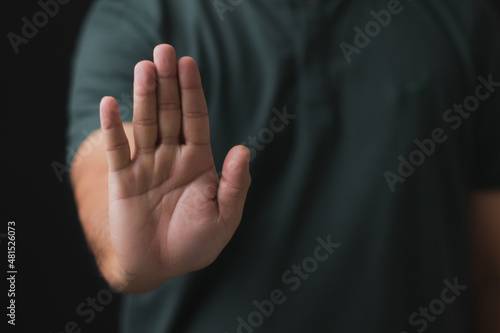 Man showing stop gesture, close up of the hand. © LOVEis