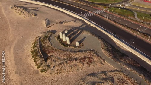 Aerial flyover famous La Mano Finger Monument on beach of Punta del Este,Uruguay photo