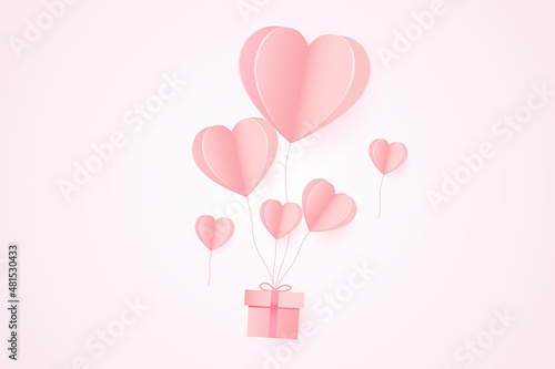 Paper art of Valentine's day festival with heart shaped balloons paper and gift box.