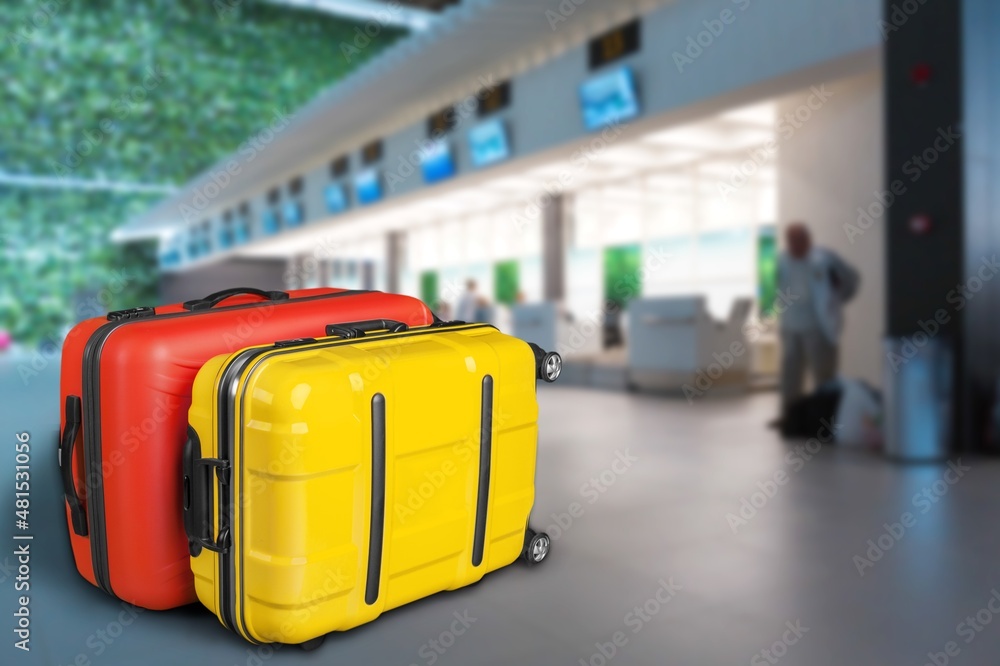 Modern stylish suitcases standing in empty airport hall, unrecognizable traveller's luggage Modern stylish suitcases standing in empty airport hall, unrecognizable traveller's luggage