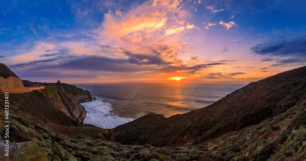Coastal cliffs and silky ocean by Devil's Slide trail in California at sunset Coastal cliffs and silky ocean by Devil's Slide trail in California at sunset