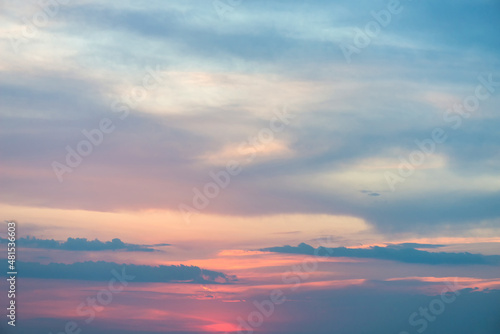 Beautiful sunset or sunrise sky in pastel soft shades of blue and pink - background