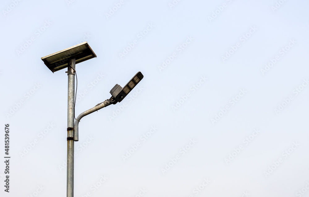 Abandoned old pole of solar light under the foggy sky with copy space Abandoned old pole of solar light under the foggy sky with copy space