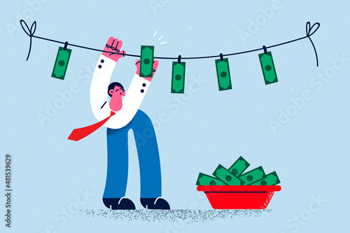 Smiling businessman involved in money laundering process 