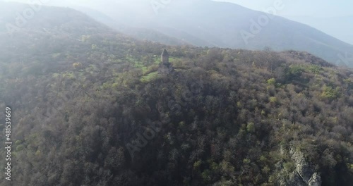 Aerial Drone Footage View: Flying from the forest over spring mountains, hills and meadows with pine forests in sun soft light. Beautiful landscape.  4K Ultra HD. Dilijan