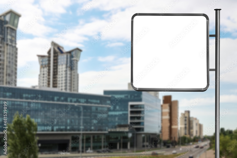 Blank advertising board near road in city. Space for text Blank advertising board near road in city. Space for text