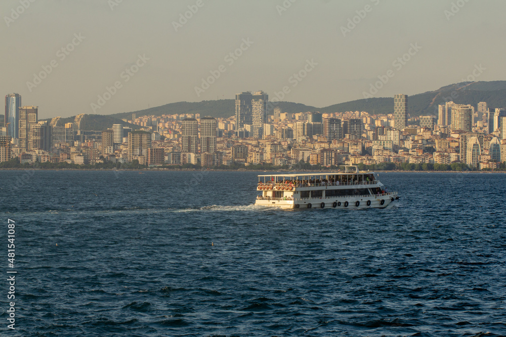 City ferry going from the Adara Islands against the background of the evening Stanbul, Turkey, Istanbul, Buyukada