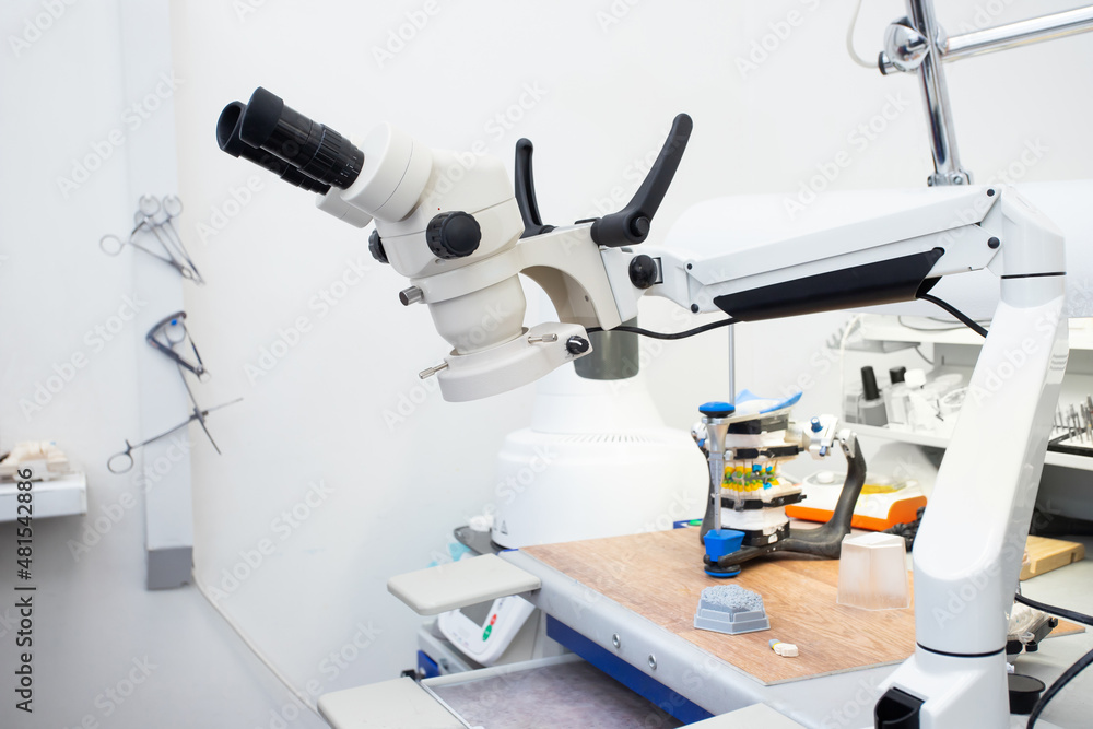 Microscope in a dental laboratory, a technician's workplace in a dental laboratory