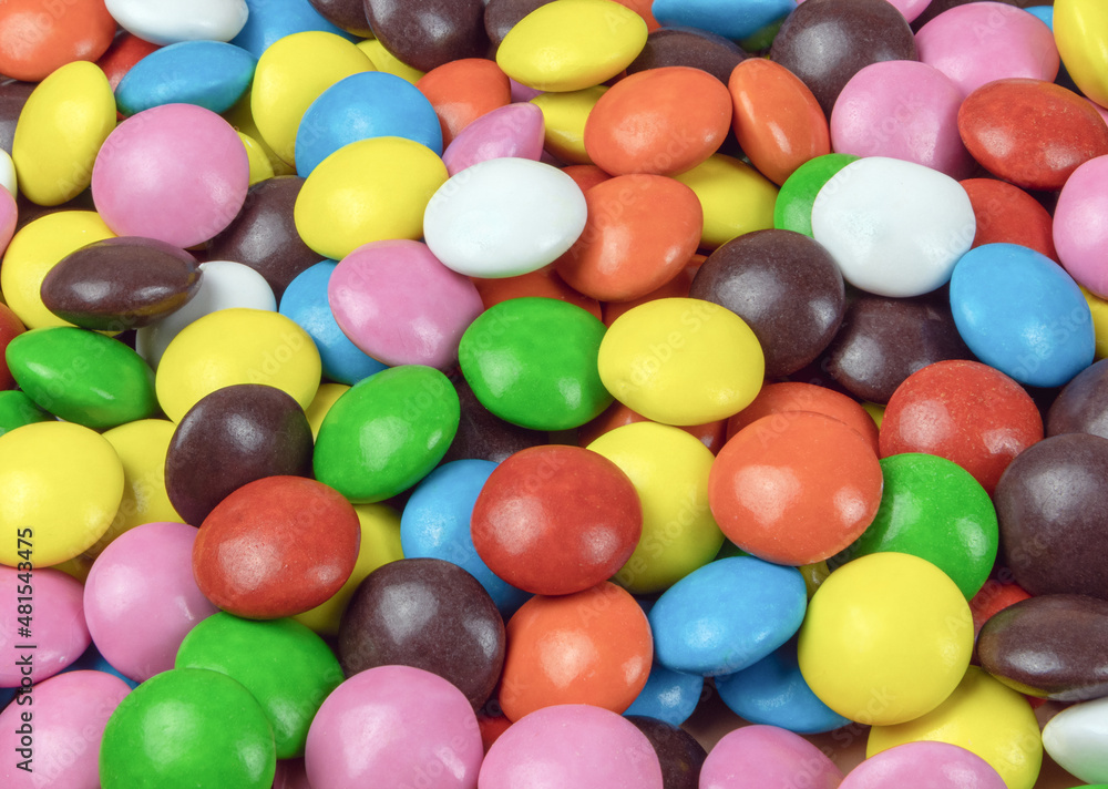 Round milk chocolate balls of different colors Round milk chocolate balls of different colors